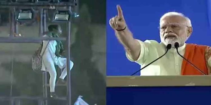 പ്രധാനമന്ത്രിയുടെ പ്രസംഗത്തിനിടെ പോസ്റ്റിൽ വലിഞ്ഞു കയറി യുവതി: അനുനയിപ്പിച്ച് മോദി പ്രധാനമന്ത്രിയുടെ പ്രസംഗത്തിനിടെ പോസ്റ്റിൽ വലിഞ്ഞു കയറി യുവതി: അനുനയിപ്പിച്ച് മോദി