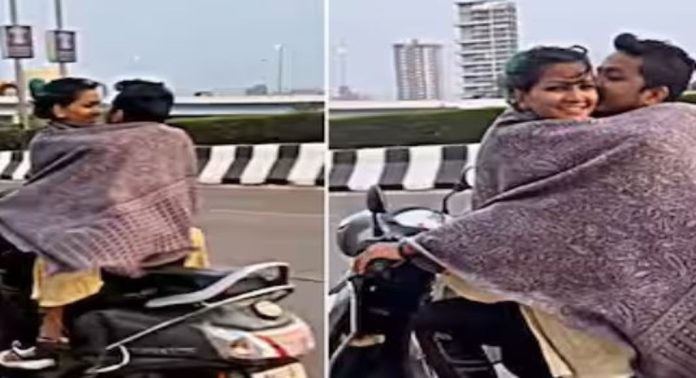 ന്യൂജെൻ റൊമാൻസ് ; സ്കൂട്ടറില് സഞ്ചരിക്കുന്നതിനിടെ ചുംബനം, വീഡിയോ വൈറൽ , പിന്നാലെ വിമർശനം….! ന്യൂജെൻ റൊമാൻസ് ; സ്കൂട്ടറില് സഞ്ചരിക്കുന്നതിനിടെ ചുംബനം, വീഡിയോ വൈറൽ , പിന്നാലെ വിമർശനം….!