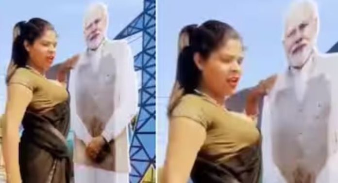 പ്രധാനമന്ത്രി നരേന്ദ്രമോദിയുടെ കട്ടൗട്ടിന് മുന്നിൽ നിന്ന് ഗ്ലാമറസ് ഡാൻസുമായി യുവതി ; പിന്നാലെ വ്യാപക വിമര്ശനം, വീഡിയോ വൈറൽ പ്രധാനമന്ത്രി നരേന്ദ്രമോദിയുടെ കട്ടൗട്ടിന് മുന്നിൽ നിന്ന് ഗ്ലാമറസ് ഡാൻസുമായി യുവതി ; പിന്നാലെ വ്യാപക വിമര്ശനം, വീഡിയോ വൈറൽ